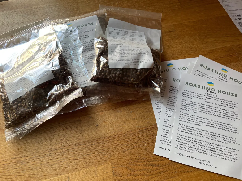 Packs of coffee in clear packaging with paper labels